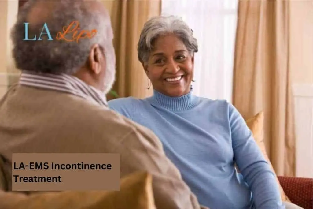 Couple sat smiling at each other - LA-EMS treatment Bicester